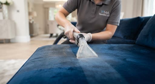 Close-up of a high-end luxury fabric being cleaned with specialist equipment